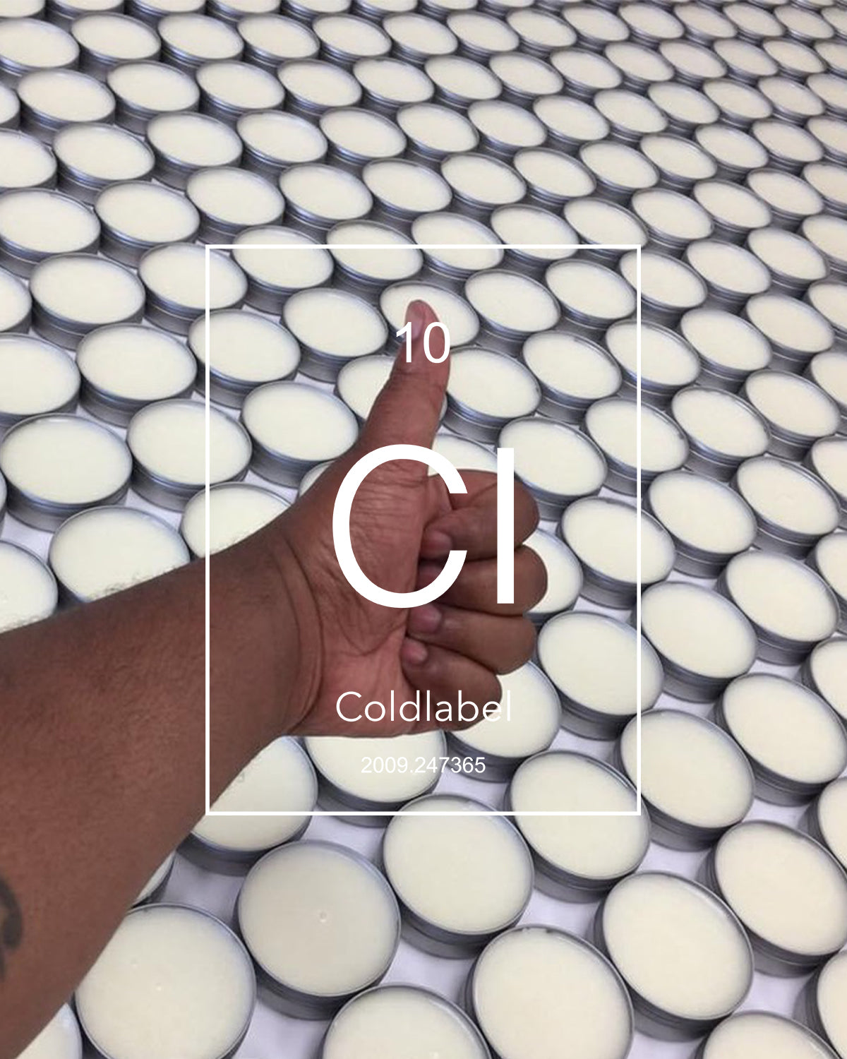 Thumbs up over freshly made cans of pomade